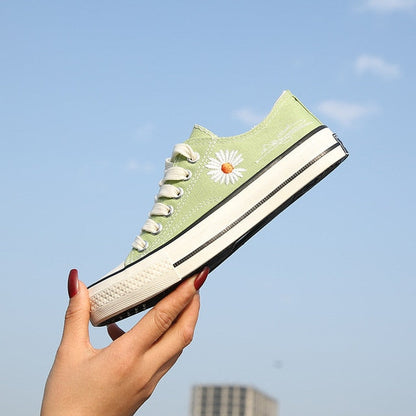 Sneakers met laag uitgesneden bloemenprint